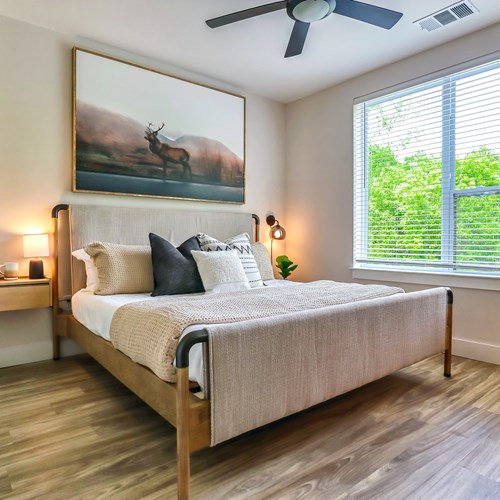 staged bedroom with large window and natural lighting