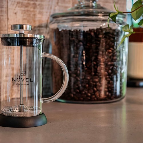 branded french press and coffee jar